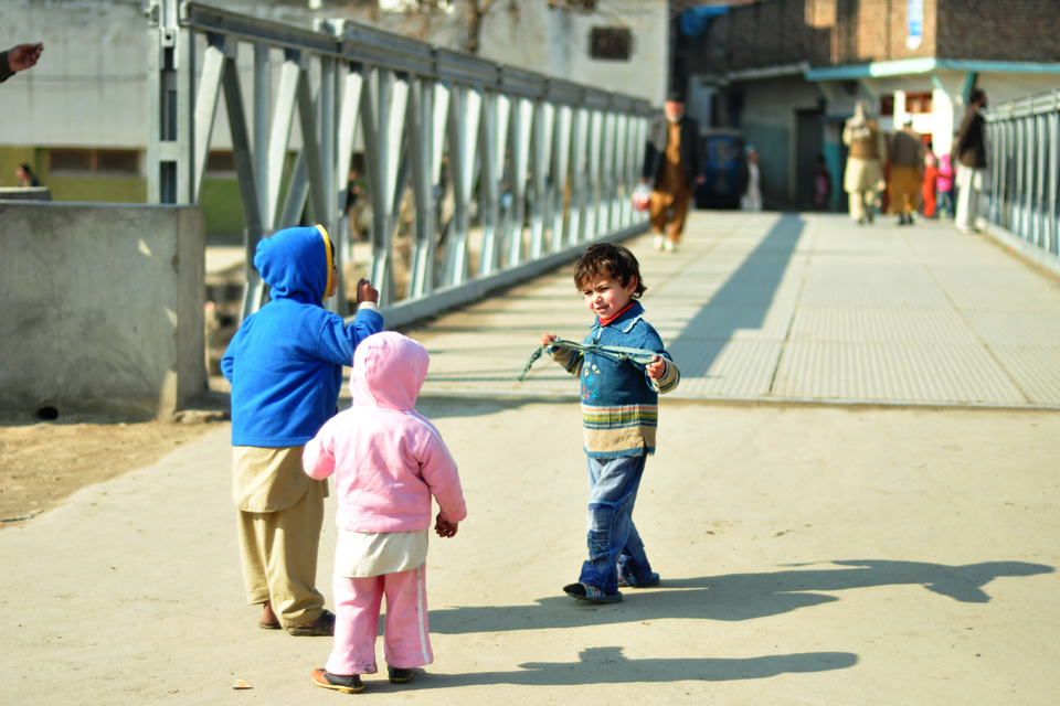 Children playing on a bridge in Malakand division. Picture: FCO