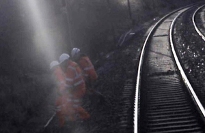 Image from forward facing CCTV image showing the track workers moved clear just before the train passed (Image courtesy of Virgin Trains)