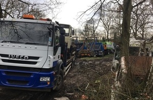 An image of Odiham Common with Bagwell Green and Shaw SSSI with vehicles, vehicle parts and tyres illegally stored on site.