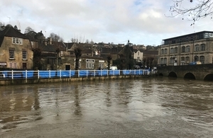high river levels and temporary flood barriers in place at bradford on avon