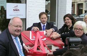 Eric Pickles, Kirsty Allsop and Grant Shapps cut red tape off a model house