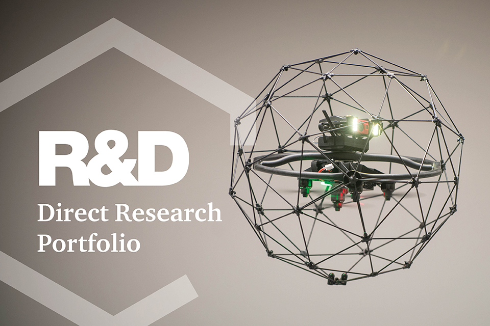 Airborne drone with R&D text superimposed over the images