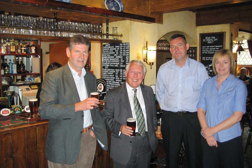 Bob Neill with the licensees of Tthe pub