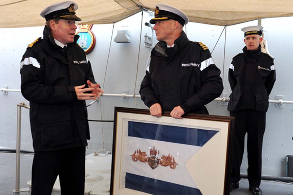 Admiral Sir Mark Stanhope presents Commander Andy Lamb with the Surface Flotilla Efficiency Pennant