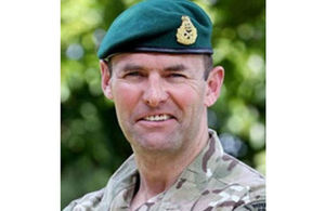 image of the new deputy commander, smiling facing the camera.