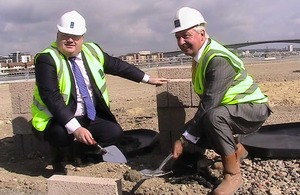 Eric Pickles laying a foundation stone