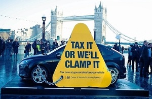 Giant clamp chained to black car outside City Hall in London