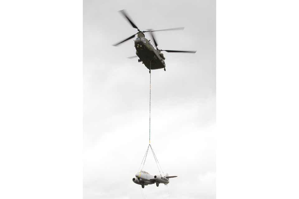The Meteor gate guardian suspended below the Chinook helicopter