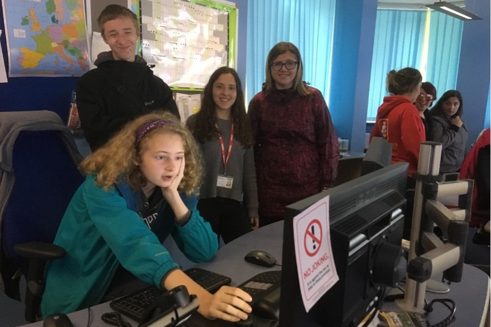 Image of a member of the Chatterbox group member looking at a computer in the CCTV control room