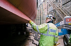 Surveyor inspecting hull