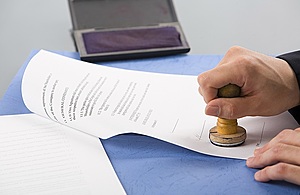 Image of stamping a certificate
