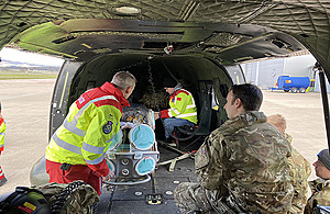 An army Puma team supporting the Scottish Ambulance Service with trial of the Epishuttle Medical System. MOD Crown Copyright.
