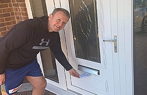 Peter Tyson delivering leaflets in his local community
