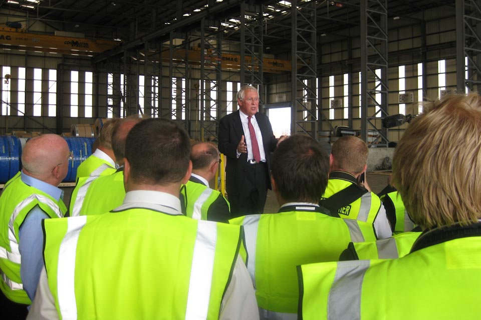 Bob Neill speaking to crowd of port workers