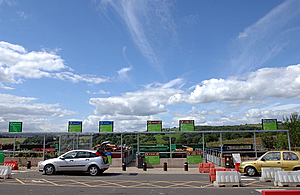 A photo of a number of large skips at a household waste and recycling centre