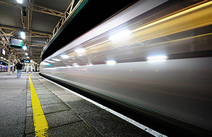 Train speeding through a station.
