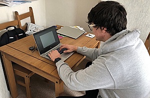 Man working at laptop computer