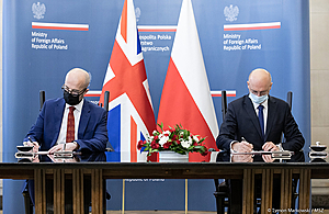 HMA Warsaw Jonathan Knott and Secretary of State for Legal and Treaty Affairs at the Polish Ministry of Foreign Affairs Piotr Wawrzyk sign the UK-Poland Voting Rights Treaty.
