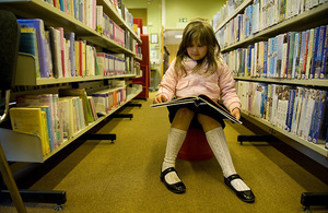 Girl reading in a library