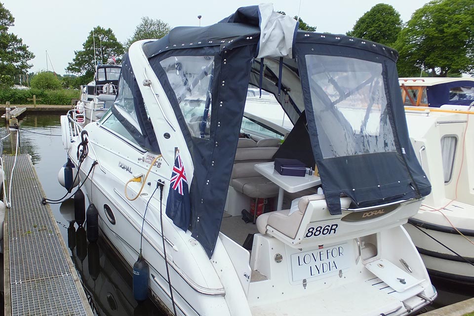 Showing the boat alongside marina after the accident with the canopy as found