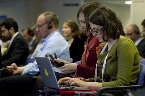 Open Government Partnership 2013 attendees using their laptops. 