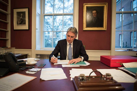 Chancellor writing his speech at his desk