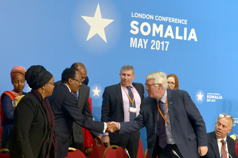 Somalian President shaking hands with an attendee of the London Somalia Conference 2017
