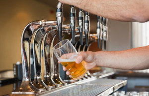 Man's hand pouring beer