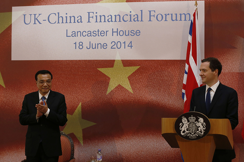 Chinese premier Li Keqiang (left) applauds as Chancellor George Osborne prepares to address the delegates of the UK-China Financial Forum at Lancaster House, in London.