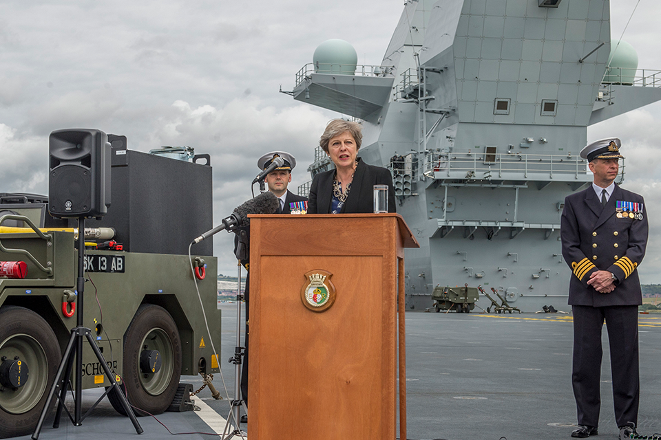 Theresa May speaking on board the HMS Queen Elizabeth