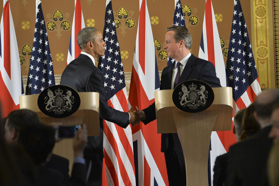 Prime Minister David Cameron shaking hands with President Obama at their joint press conference.