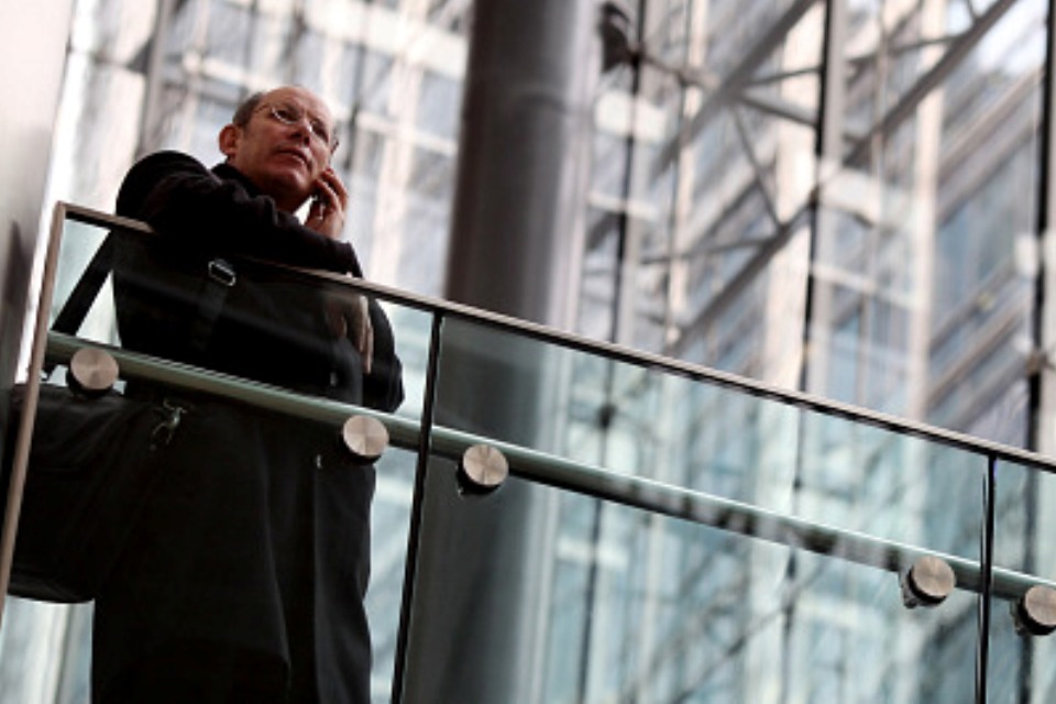 Businessman speaking on mobile phone. Photo by Getty Images