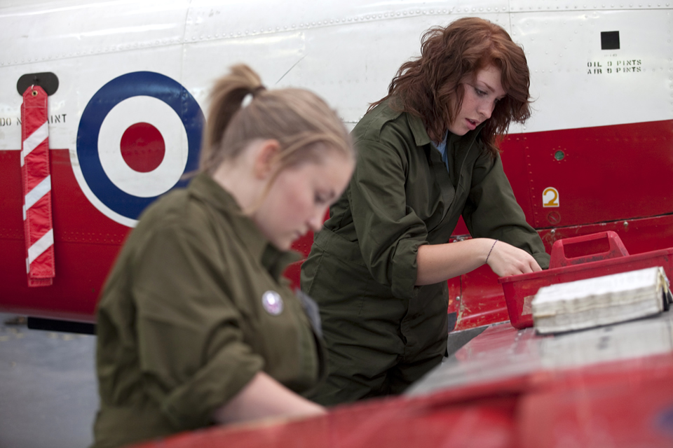 young women repairing an aeroplane