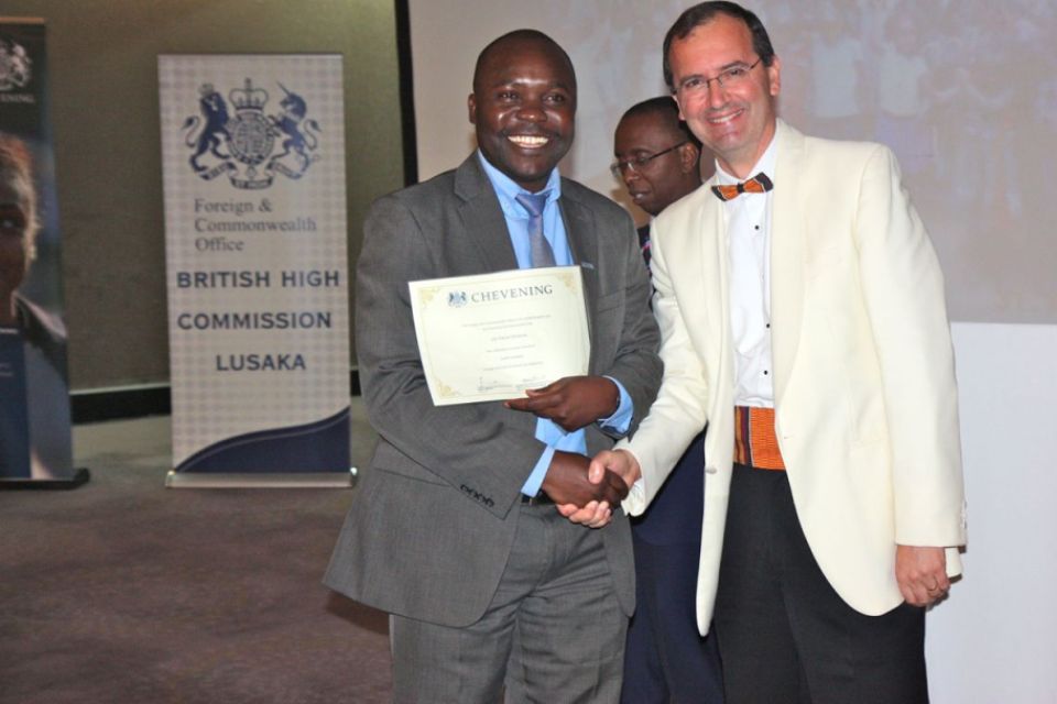 British High Commissioner Fergus Cochrane-Dyet presents certificates to returing scholars