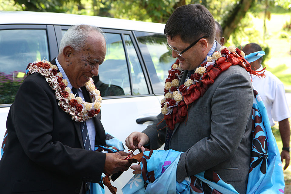 Fiji's Minister for Defence Hon Jonetani Cokanasiga hands over the keys to the welfare centre to the High Commissioner His Excellency Roderick Drummond.