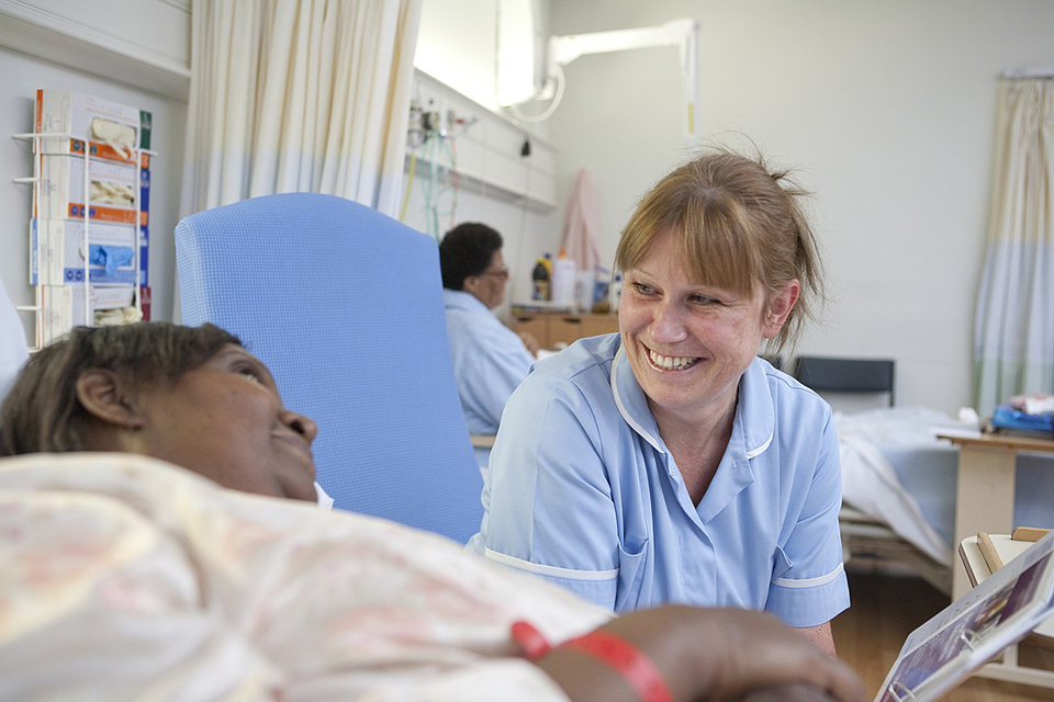 Nurse smiling with patient