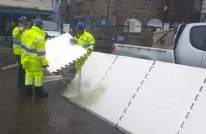 Temporary flood defences being put in place