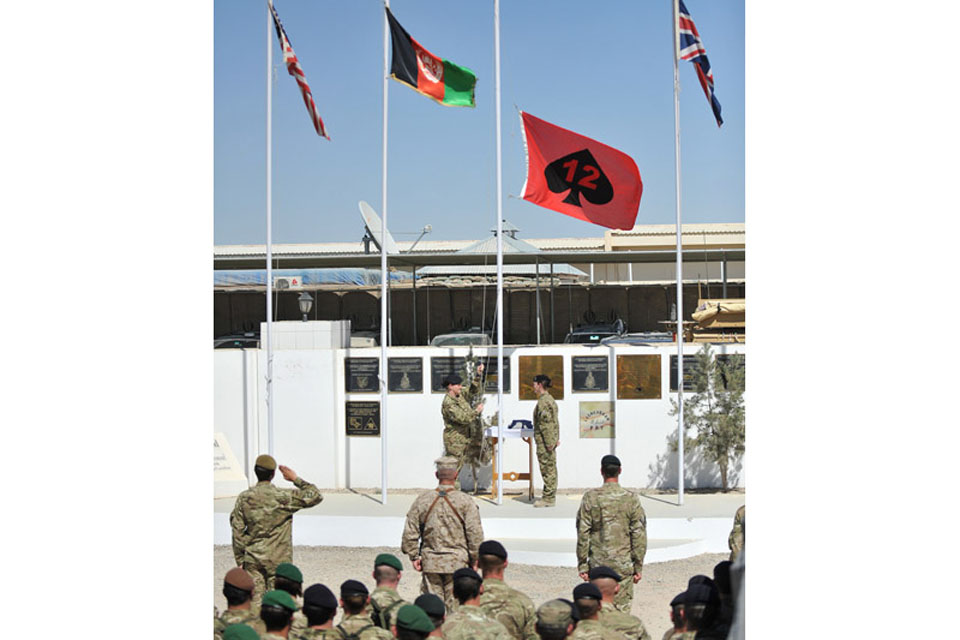 The 12 Mechanized Brigade flag is raised during the handover ceremony 