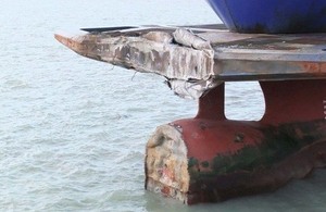 Damage to the vessel's bulbous bow and "cow-catcher"
