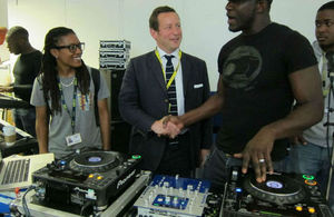 Ed Vaizey meeting young people next to music mixing equipment