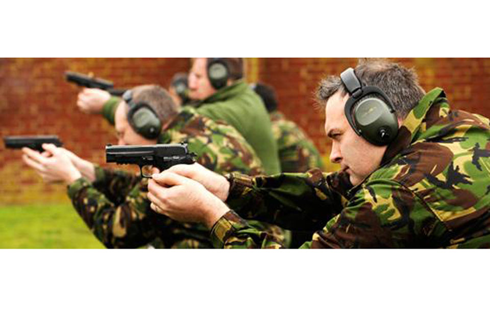Members of 31 Squadron practise firing pistols 