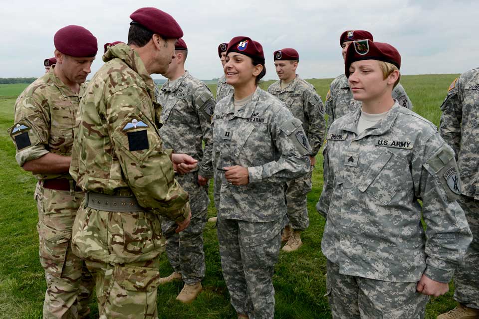 Major General Ranald Munro awards US paratroopers their British wings