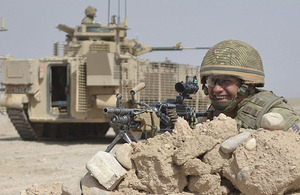 A soldier from 3rd Battalion The Mercian Regiment is pictured with one of the new up-armoured Warrior infantry fighting vehicles in Afghanistan