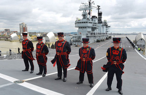 Yeoman Warders from the Tower of London at the top of HMS Illustrious's ramp as she transits the Thames Barrier [Picture: Leading Airman (Photographer) Dean Nixon, Crown copyright]