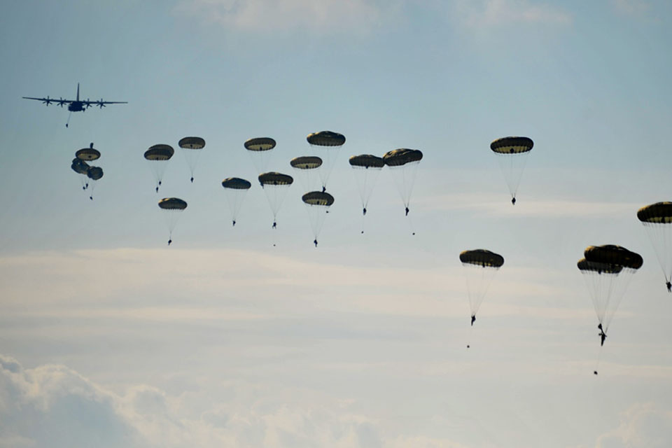 Troops from 16 Air Assault Brigade parachute from a C-130 Hercules during Exercise Joint Warrior