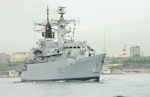 HMS Cumberland passes Plymouth Hoe on her way out of Devonport Naval Base (stock image)