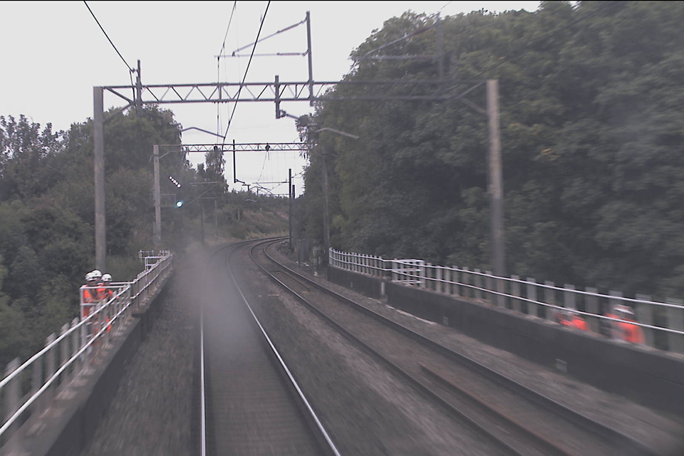 Image from a northbound train (on the down line) at 16:54 hrs. The down side sub-team can be seen in a refuge. The up side sub-team can be seen on the right, stood on the string course. (Image courtesy of Virgin Trains)