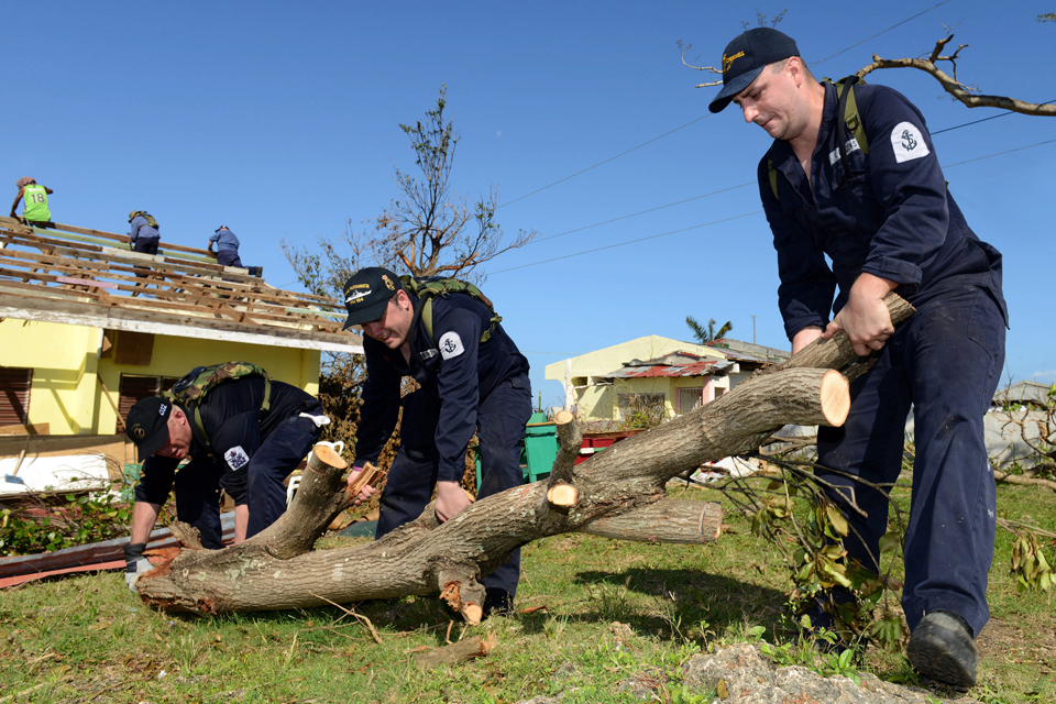 Members of HMS Daring's crew clearing debris