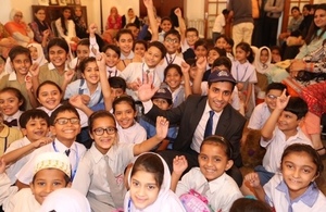 Mr. Rehman Chishti MP school children at an event organised for the British publisher Ladybird at the Deputy High Commission
