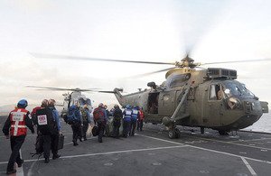 HMS Illustrious's Sea King helicopter being loaded with supplies [Picture: Leading Airman (Photographer) Nicky Wilson, Crown copyright]